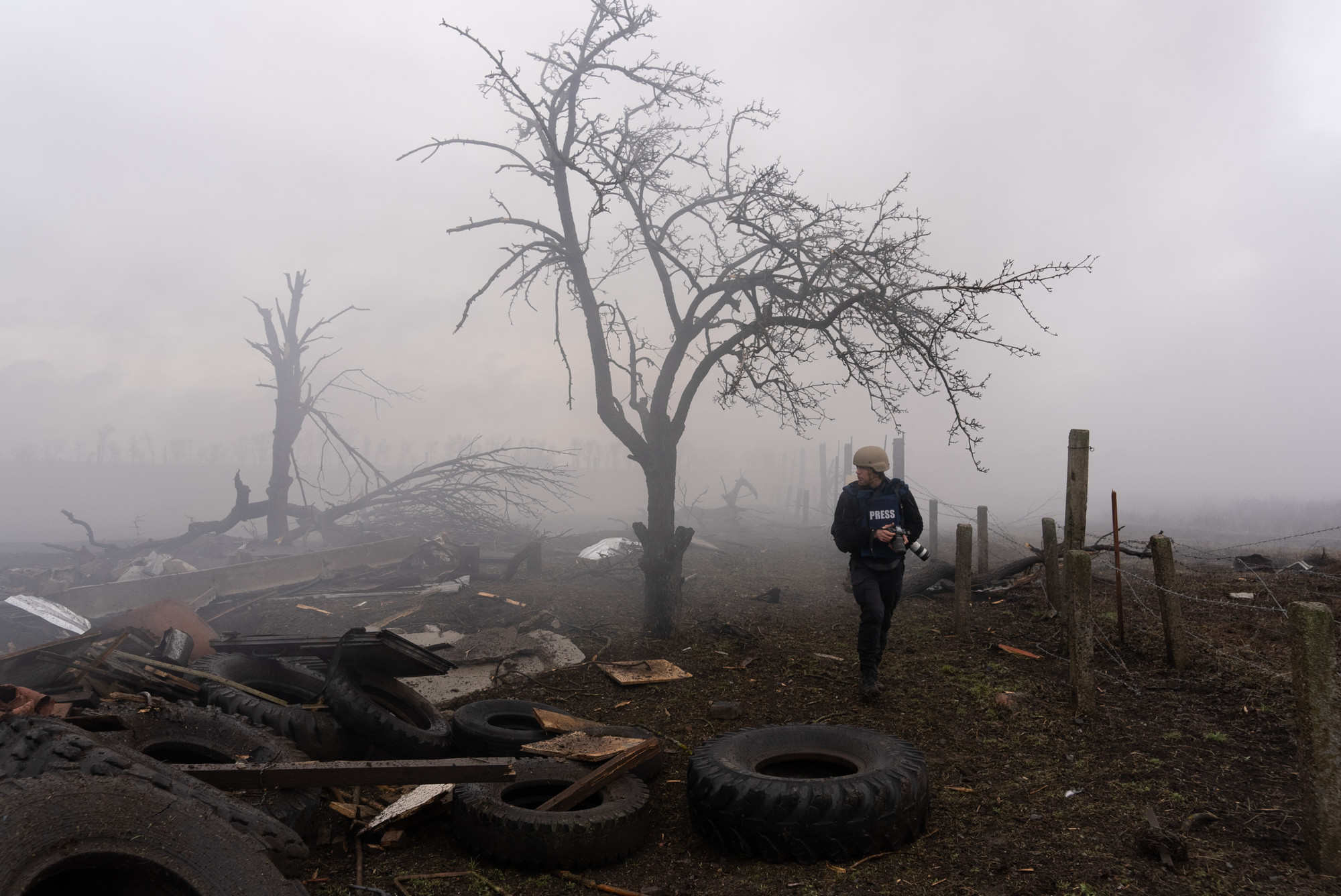 Photographer Evgeniy Maloletka picks his way through the aftermath of a Russian attack in Mariupol, Ukraine, Feb. 24, 2022. Still from FRONTLINE PBS and AP’s feature film “20 Days in Mariupol.” CREDIT: (AP Photo/Mstyslav Chernov)
